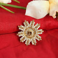 An adjustable gold-polished ring featuring shimmering American Diamond stones.