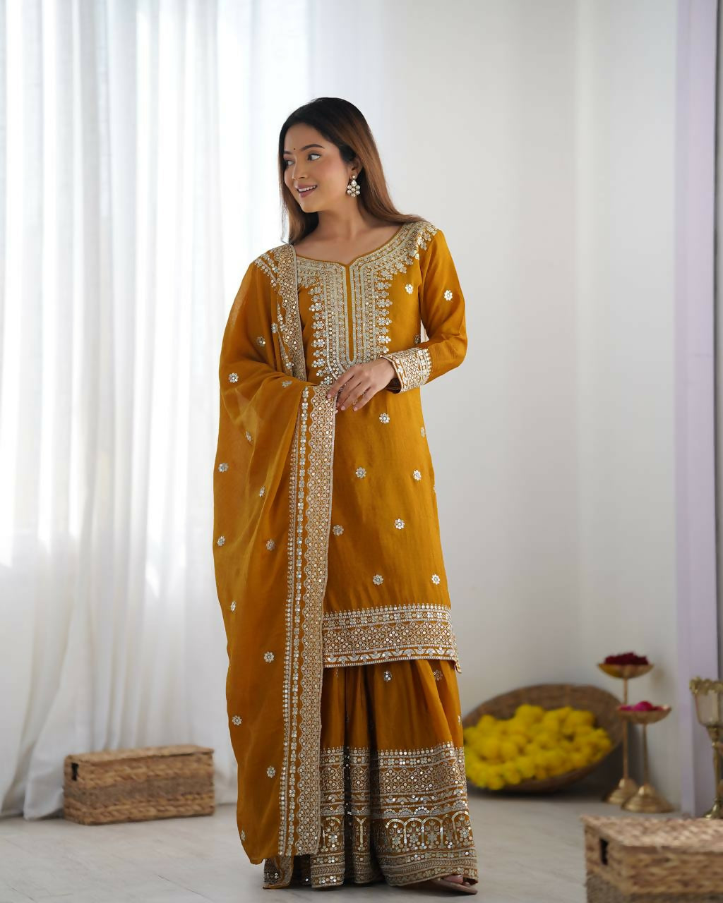 Mustard silk kurta set with ornate sequins, zari, and thread embroidery