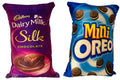 Set of two reversible novelty throw pillows featuring Cadbury Dairy Milk Silk and Mini Oreo designs.