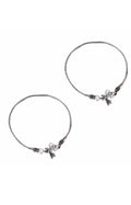 Close-up of elegant oxidised silver-plated traditional anklets with intricate metalwork
