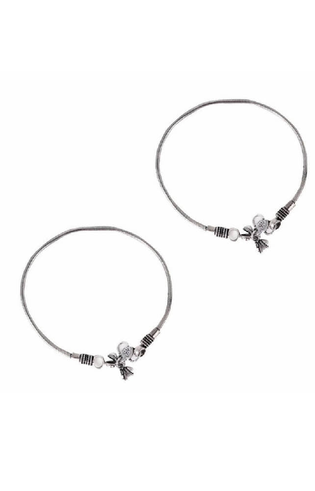 Close-up of elegant oxidised silver-plated traditional anklets with intricate metalwork