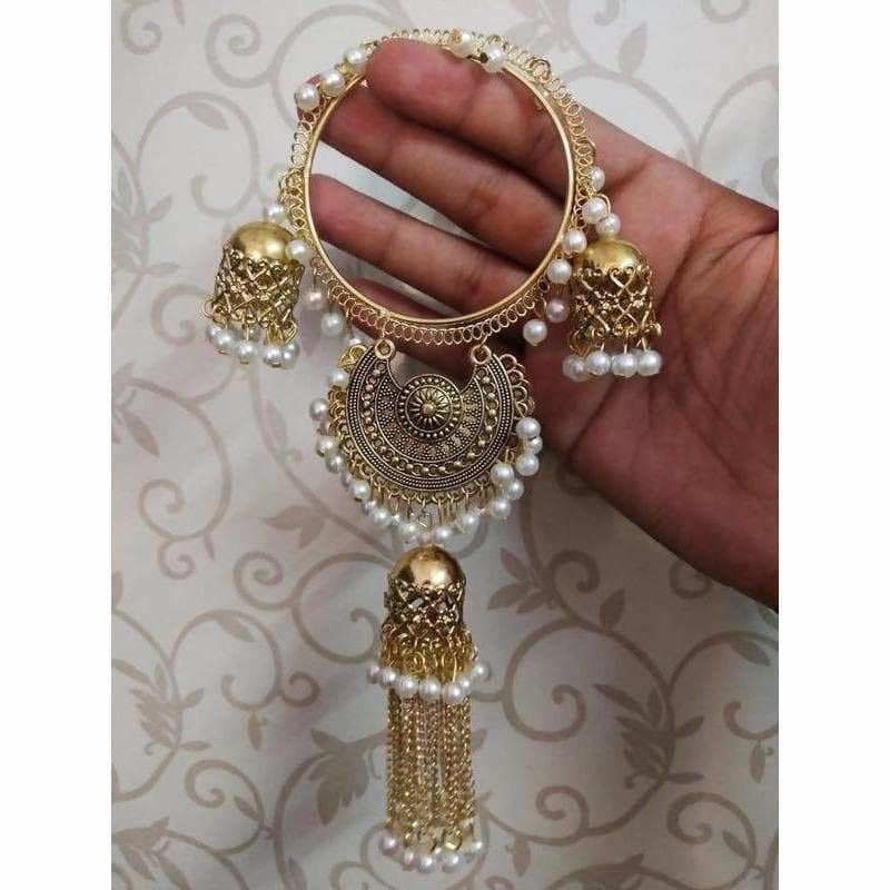 Gold-toned bridal bangles with white pearls and hanging jhumka latkans