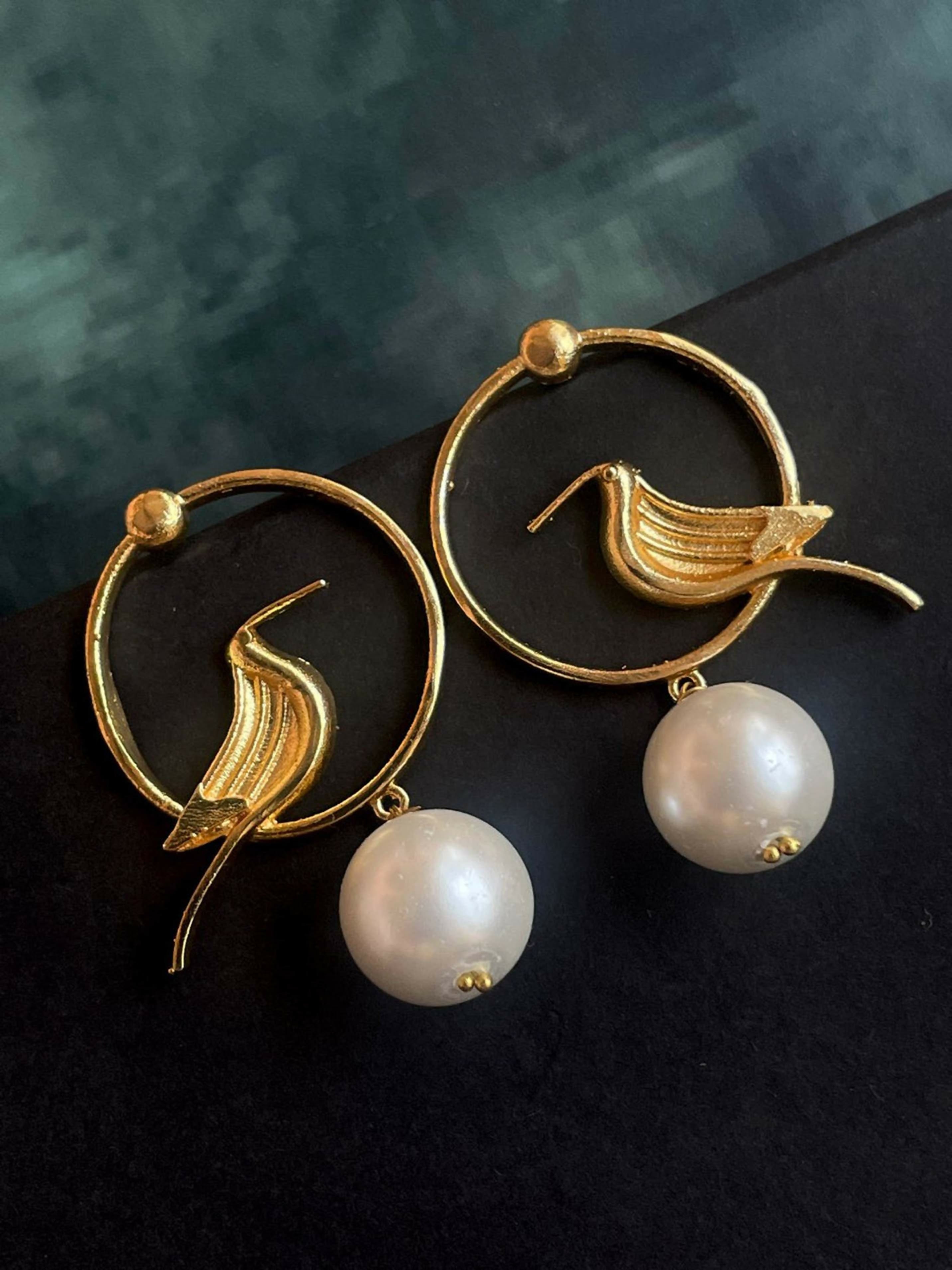 Elegant white pearl stud earrings with a gold-tone top, 4.5 cm length