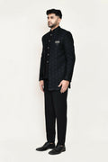 Black jacquard Prince coat and pant formal ensemble for men.