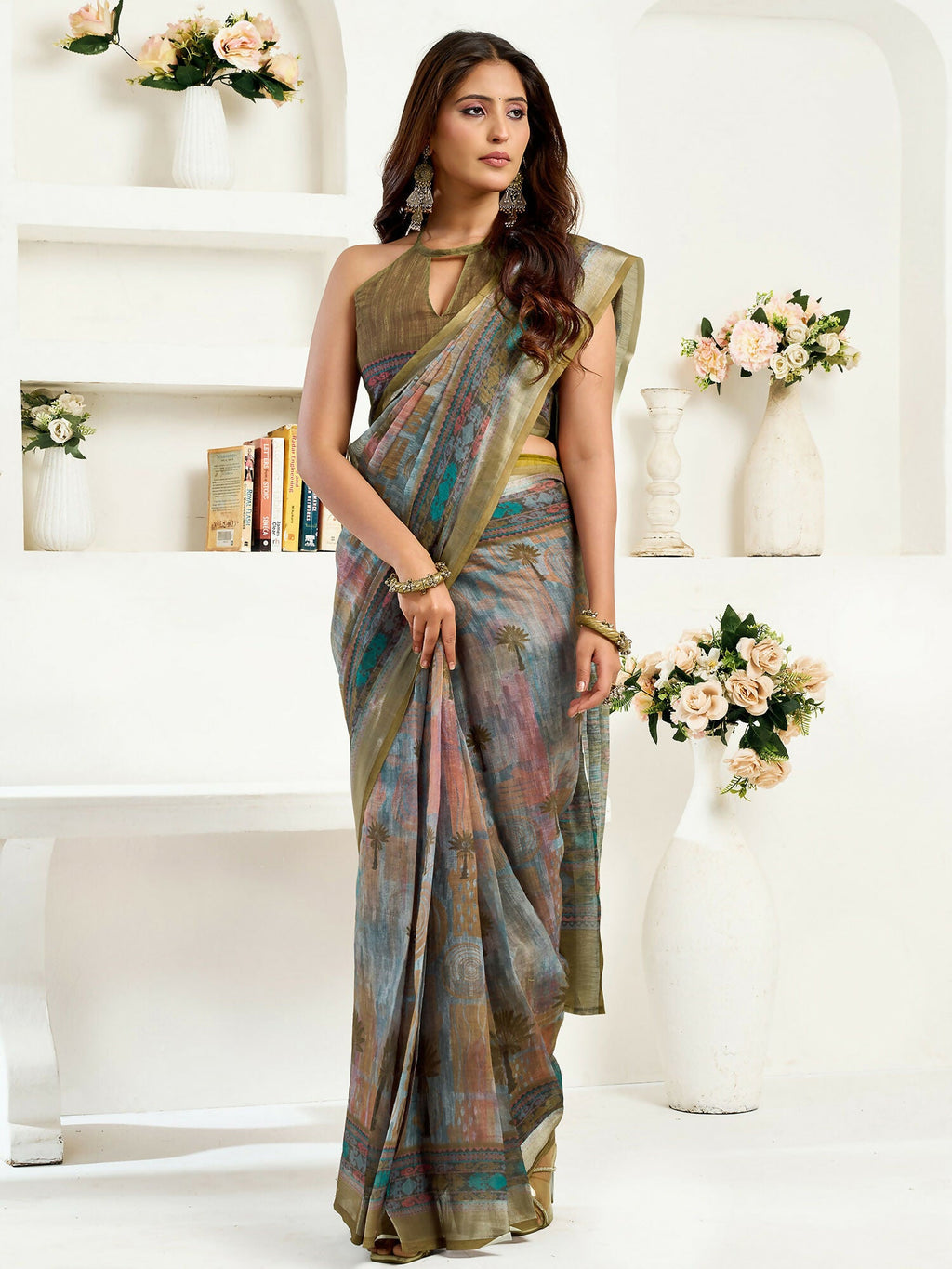Dusty green linen ready-to-wear saree with floral and ethnic motifs and unstitched blouse.