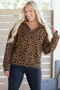 Women wearing a brown and black leopard print quarter zip sweatshirt in a casual streetwear style