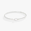 Faceted hook tension bracelet available in silver, gold, rose-gold, and black finishes.