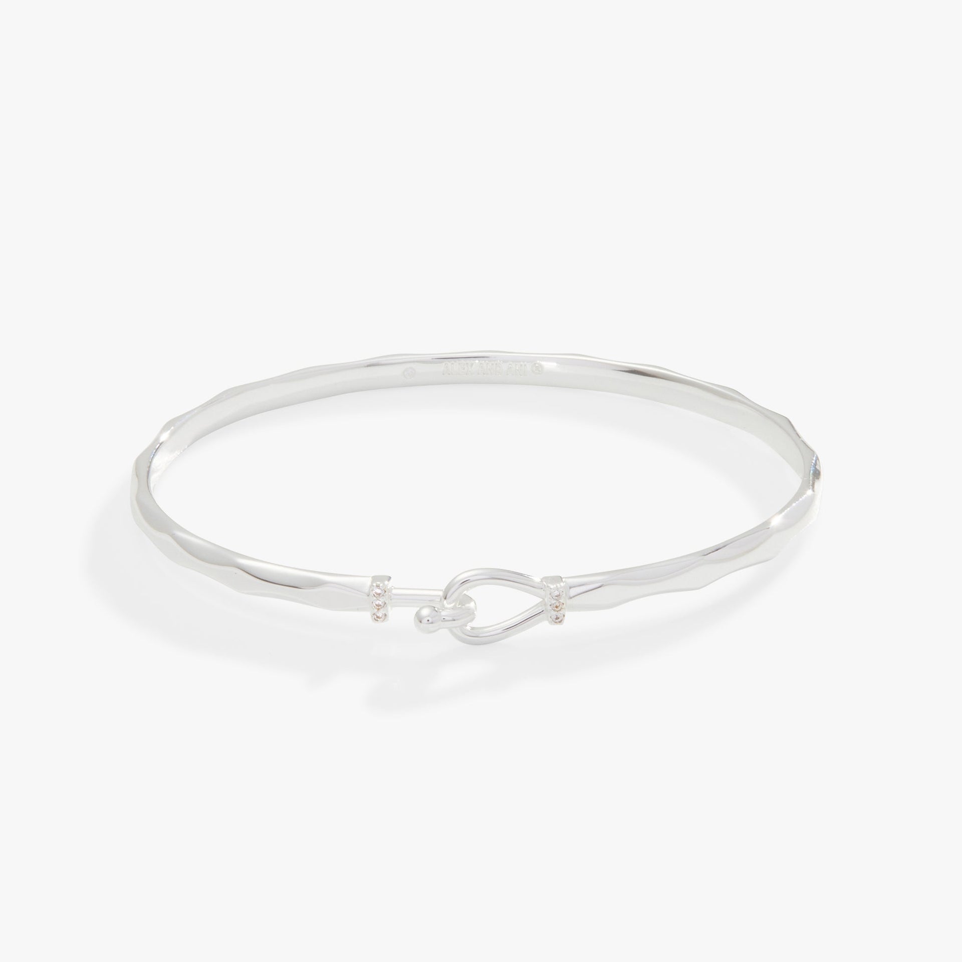 Faceted hook tension bracelet available in silver, gold, rose-gold, and black finishes.