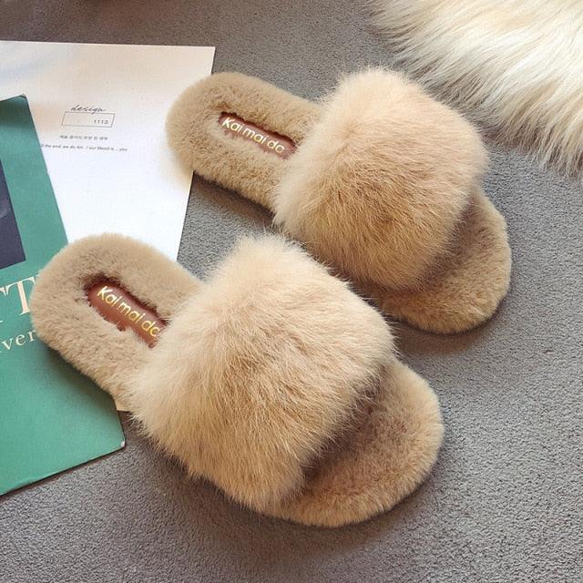 Close up of plush faux fur open-toe house slippers with memory foam footbed