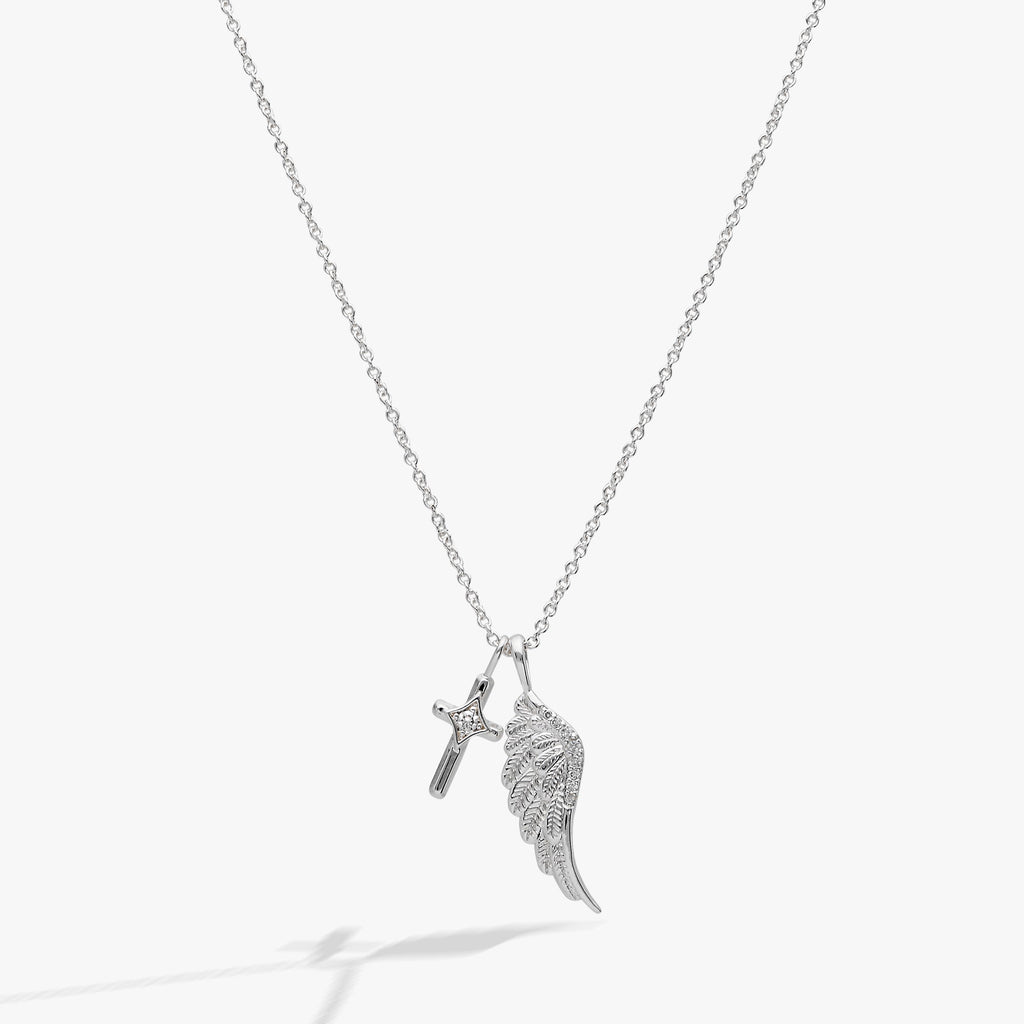 Silver-plated angel wing and cross charm necklace with crystal pave accents