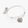 Minimalist 'Family Forever' bangle featuring an angel wing and heart charm, available in silver, gold, and rose-gold tones.