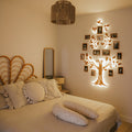 Nova Wooden LED Family Tree with warm lighting and photo display branches on a living room wall