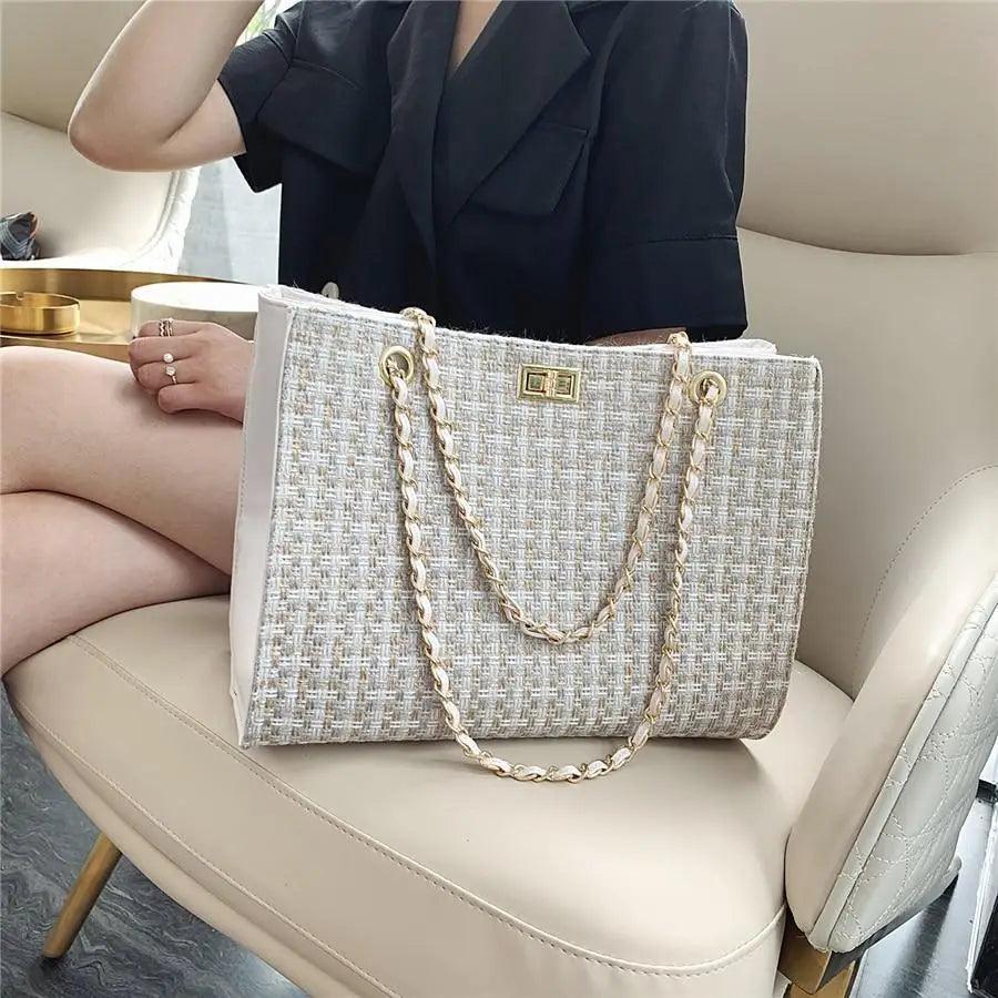 Elegant beige geometric PU leather shoulder bag with a gold chain strap