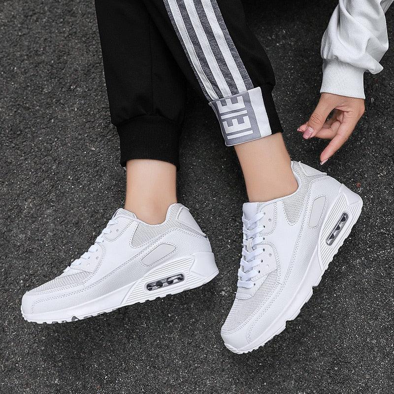 Unisex air cushion athletic running sneakers in black, white, and multi-colored sporty designs.
