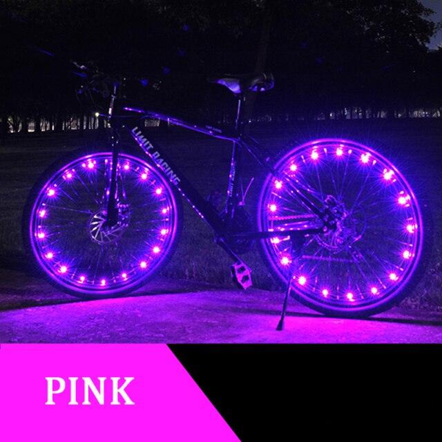 Bright LED bicycle spoke strip light installed on a bike wheel for enhanced night safety.
