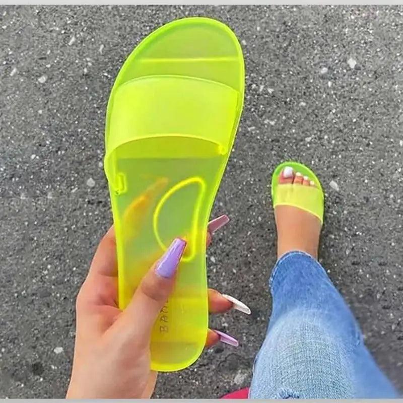 Elegant transparent jelly sandals in candy colors with a modern slide design