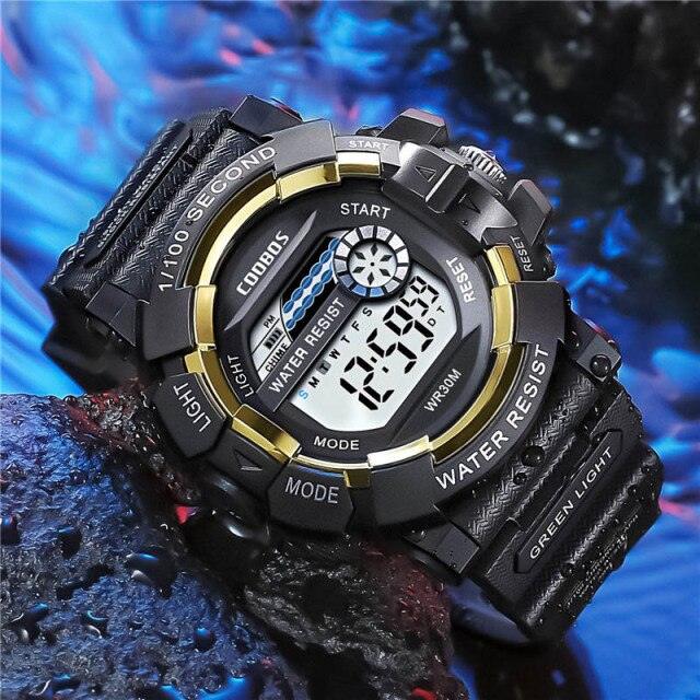 Kids digital sport watch in black and gold with silicone strap and LED display.