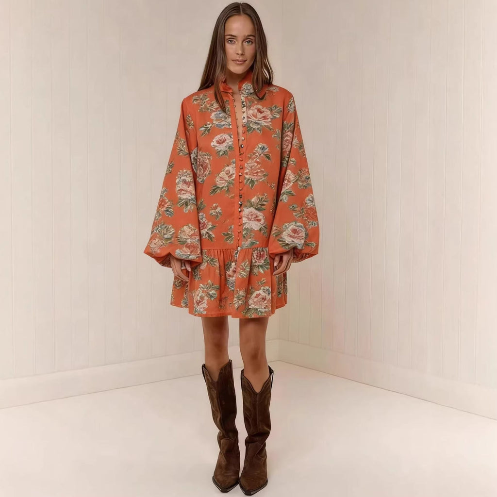 Model wearing a floral print button-front mini dress with lantern sleeves and a drop-waist hem.