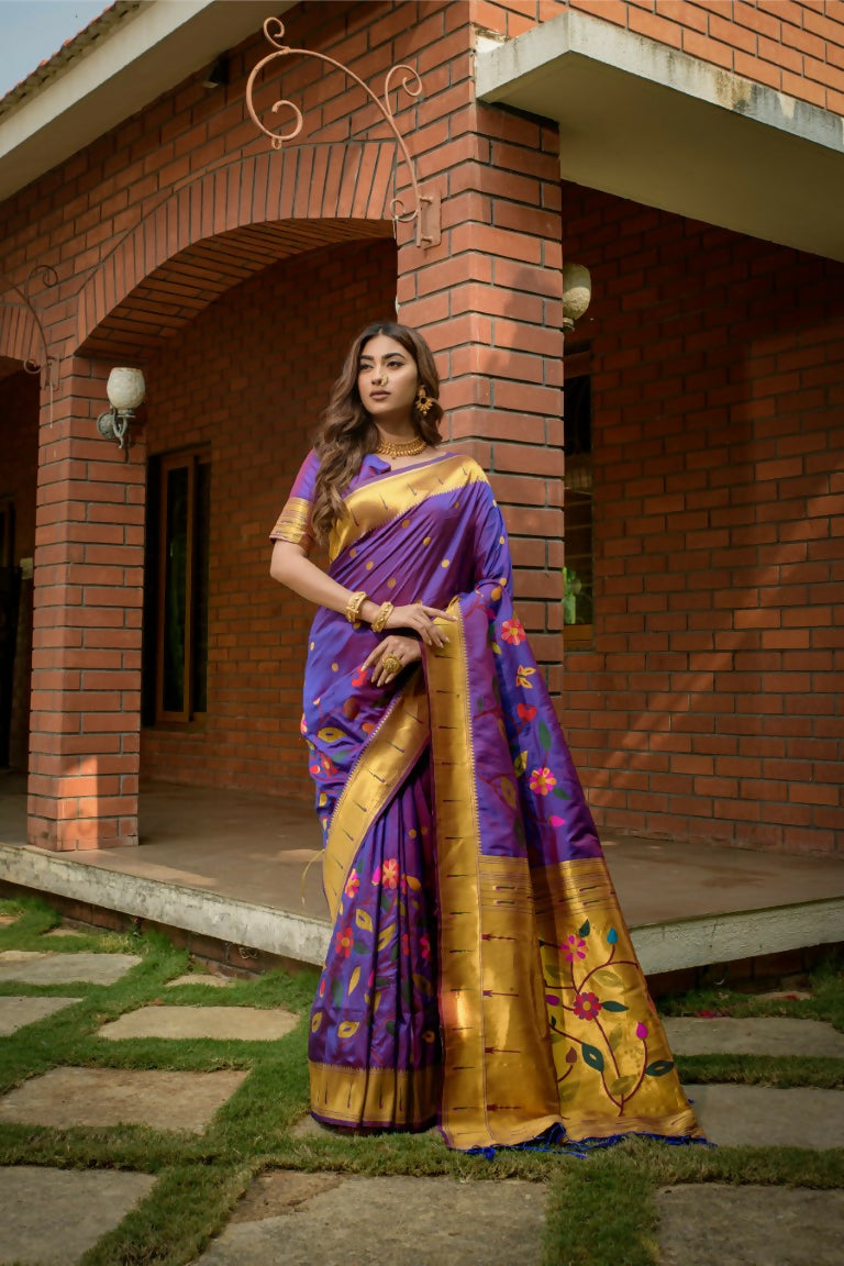 Purple Paithani silk saree with gold zari woven accents and a matching blouse.