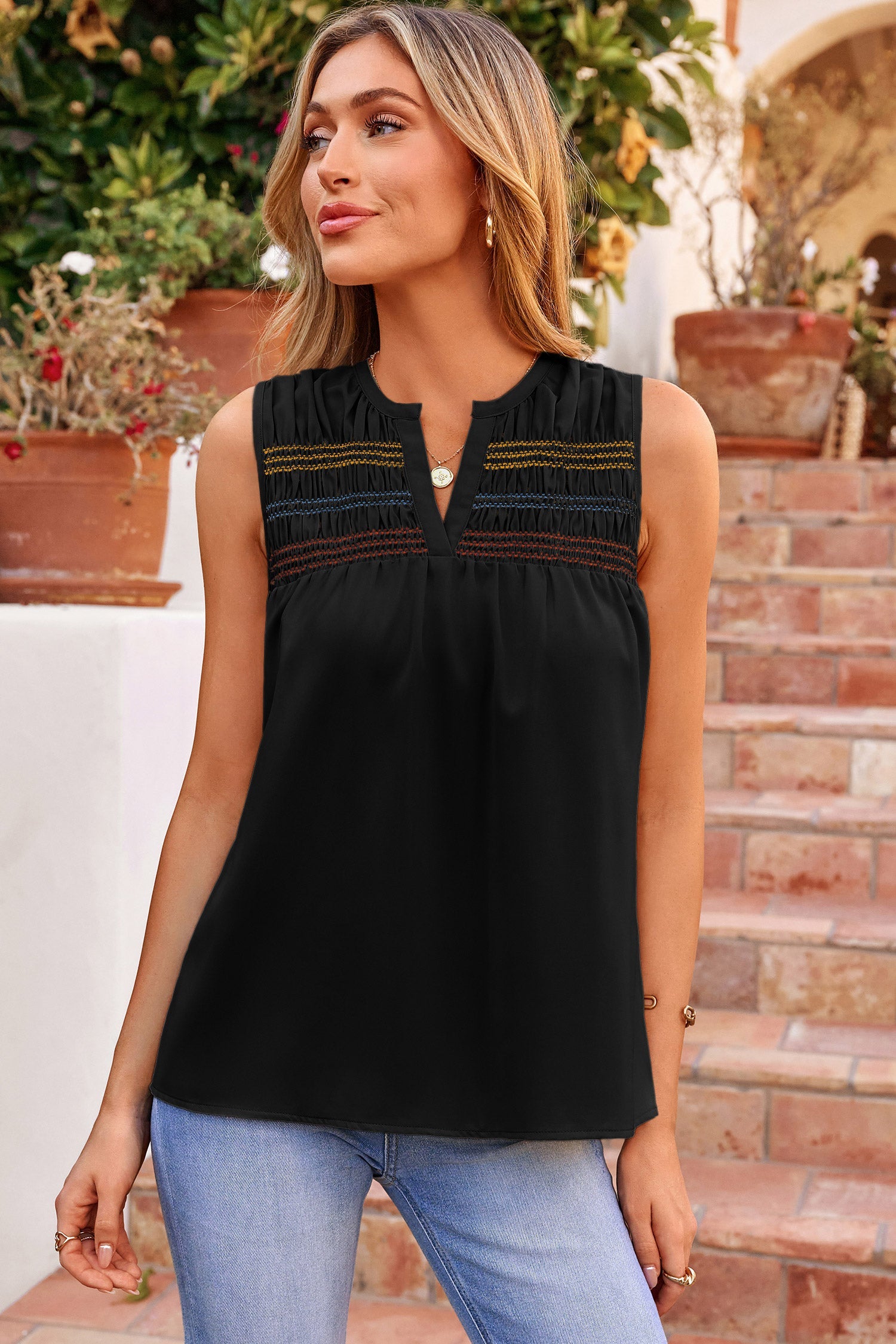 Black and multi-colored Mazie sleeveless shift top featuring a smocked bust and V-neckline.