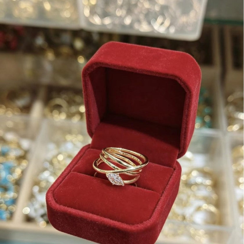 Large gold-tone water-drop ring with marquise-cut clear zircon stone and multi-band layered design