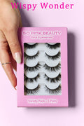 Close up of Wispy Wonder So Pink Beauty mink eyelashes variety pack containing 5 pairs of lashes held by a hand.