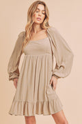 A stylish mini dress featuring balloon sleeves, a square neckline, and a ruffled hem.