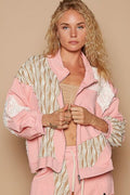 Pink zip-up track jacket featuring creative applique patchwork details