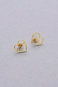 Close up of personalized gold-tone custom script name stud earrings