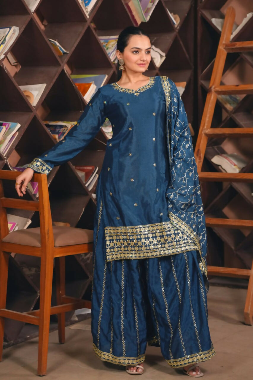 Elegant blue silk sharara set with intricate embroidery and matching dupatta