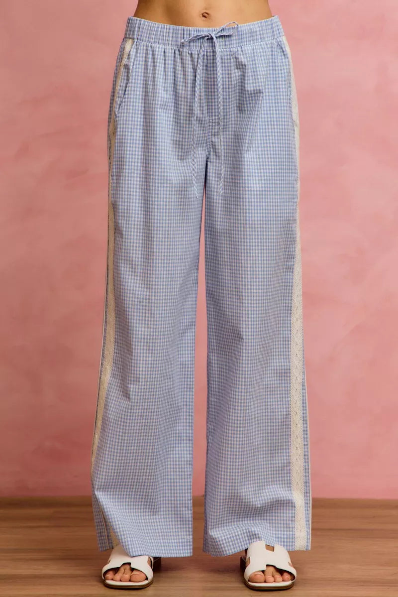 Light blue and white gingham wide-leg pants with cream lace trim and piping detail
