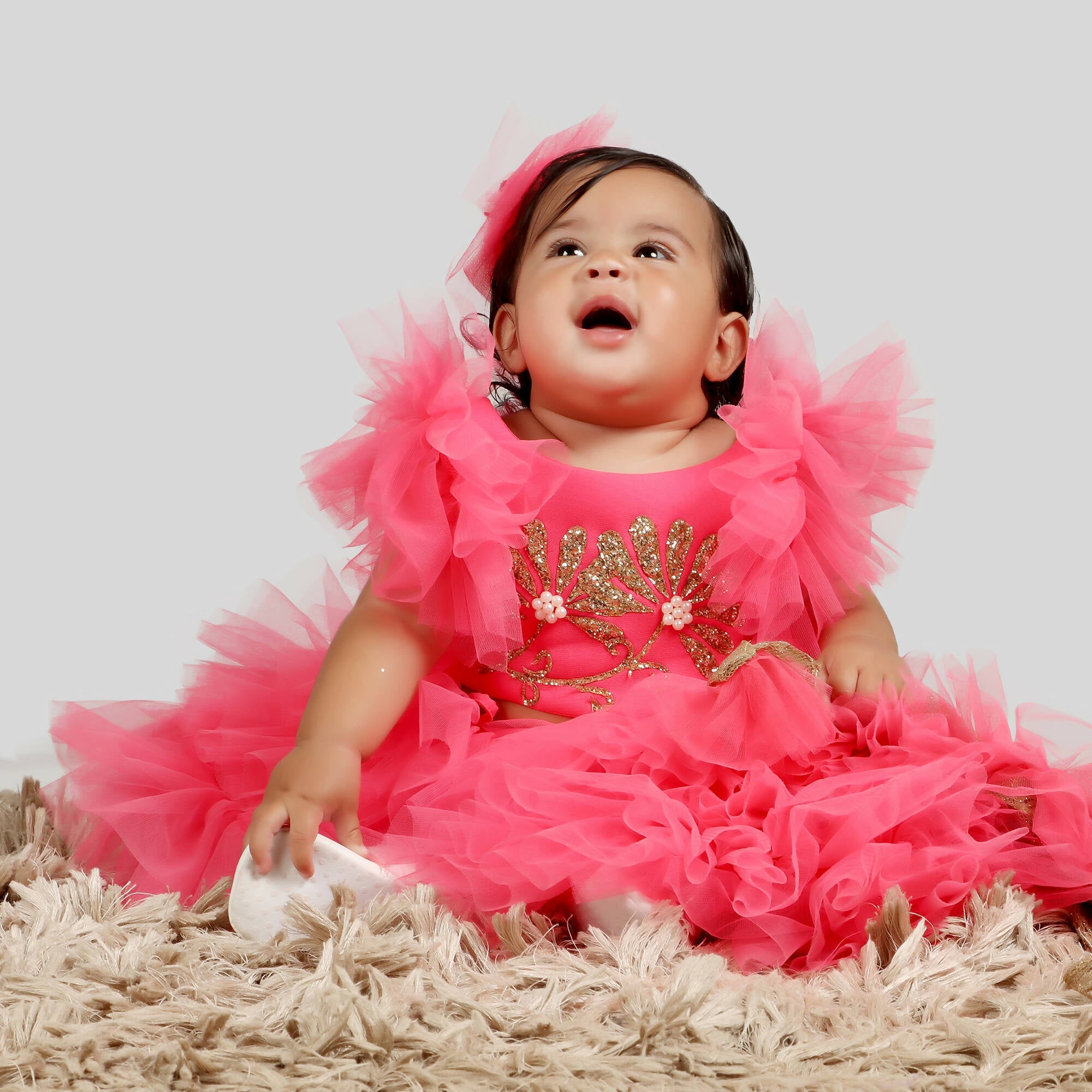 Pink gown with scuba bodice, golden patch, net ghera, and frill sleeves