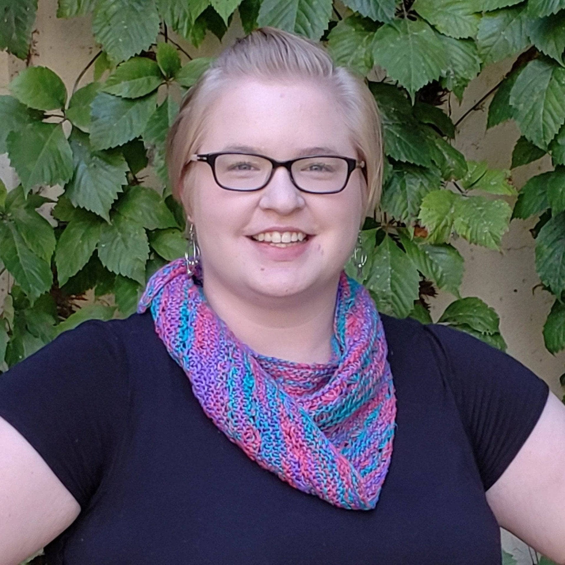 Hand-knitted Field of Dreams shawl in pink, purple, and teal silk yarn