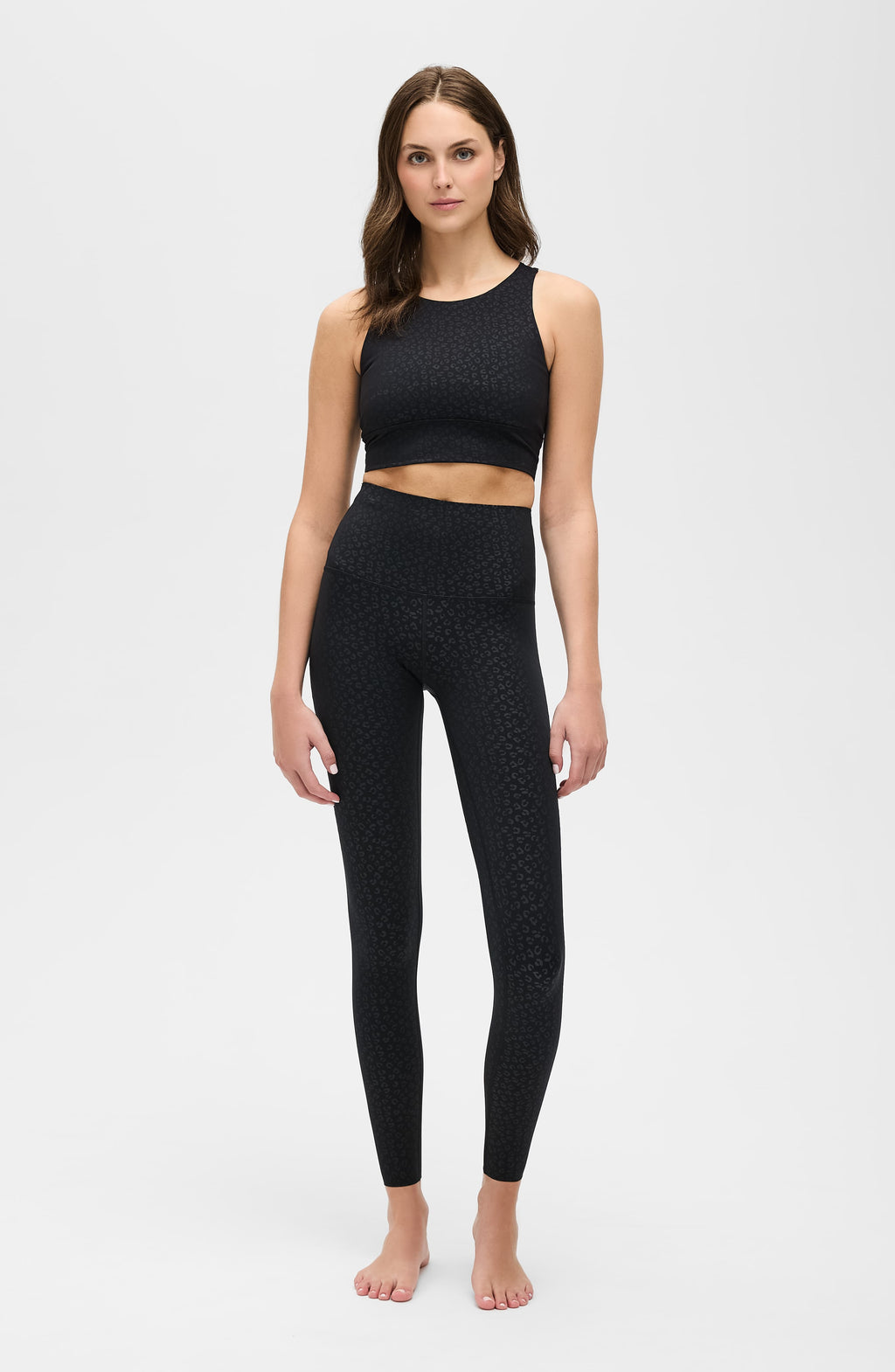 Close up of The Fierce Leggings in black animal print pattern featuring a wide high waistband.