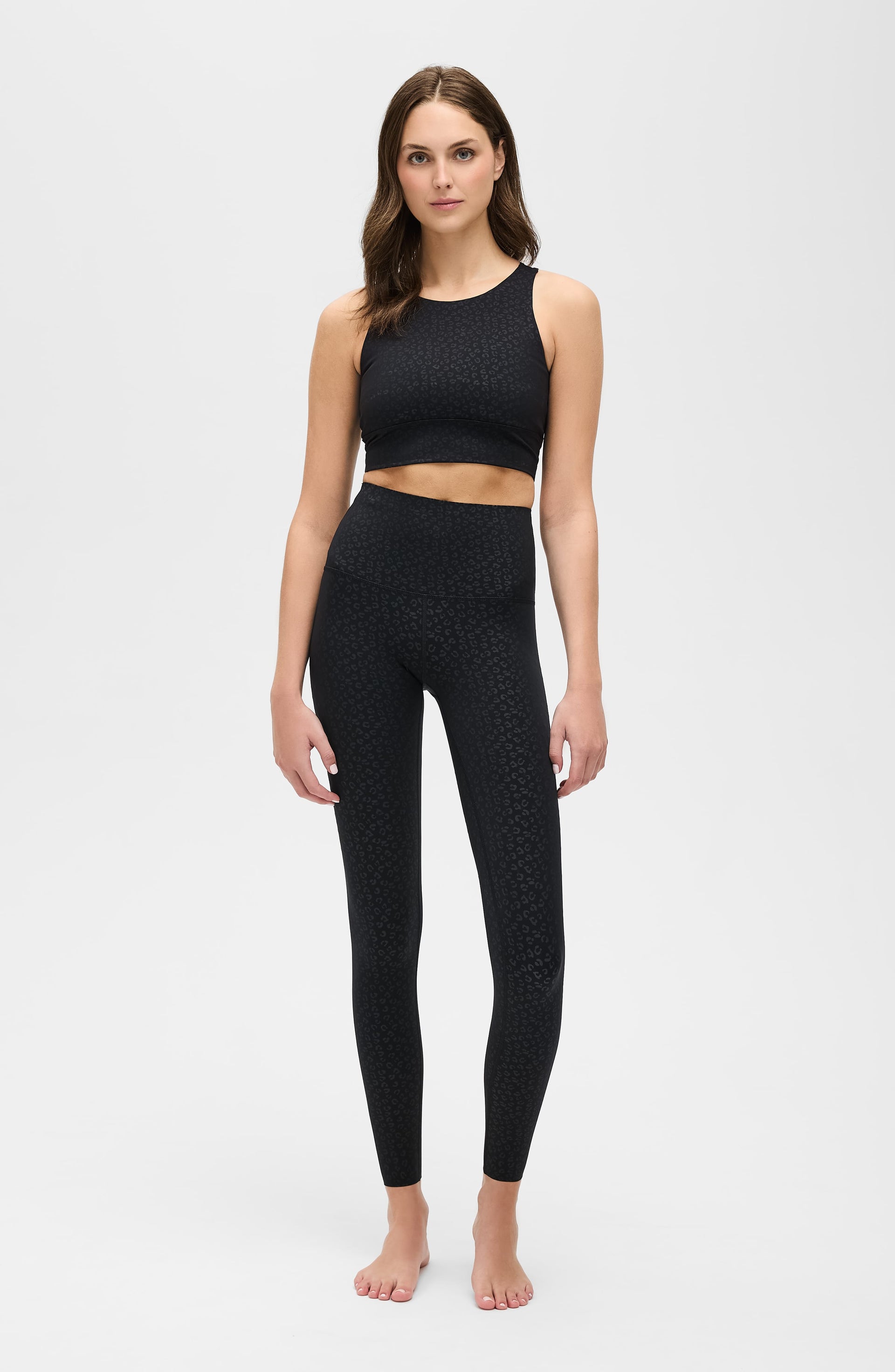 Close up of The Fierce Leggings in black animal print pattern featuring a wide high waistband.