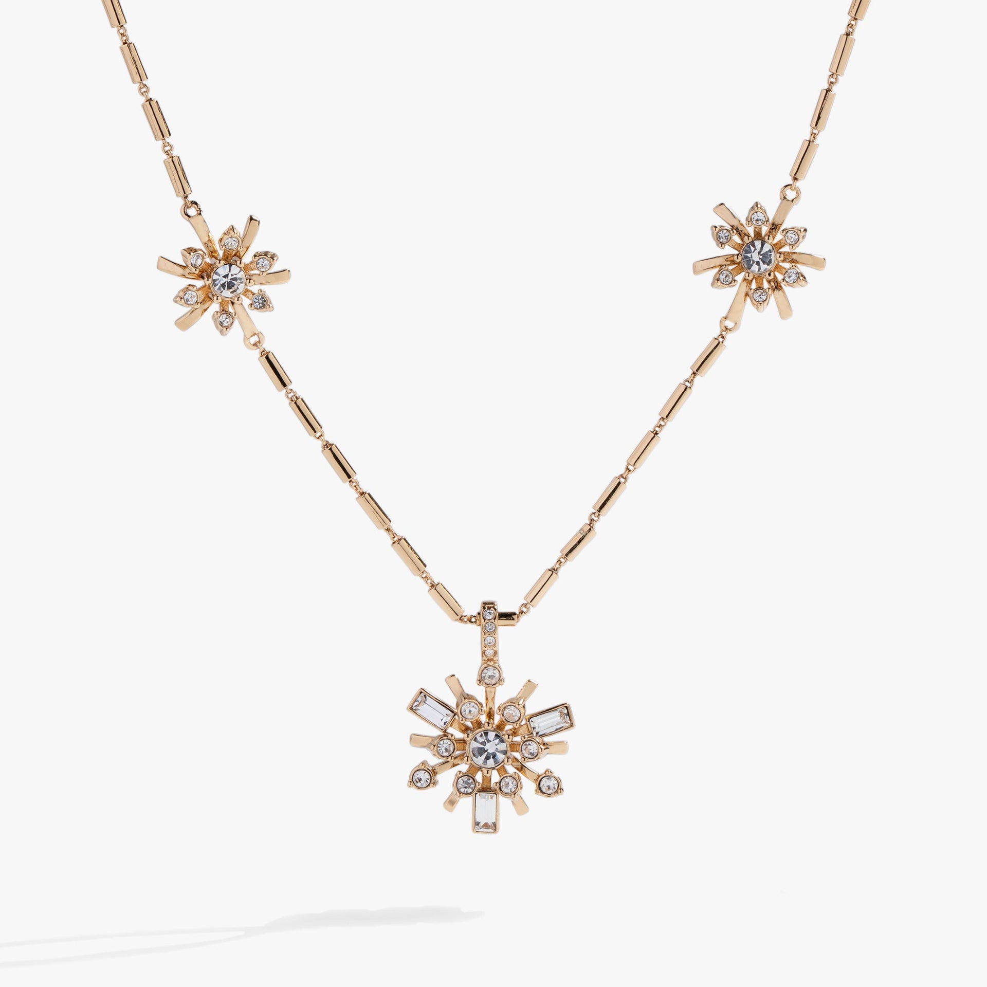 Festive Sparkle crystal starburst inline pendant necklace on an adjustable textured chain.