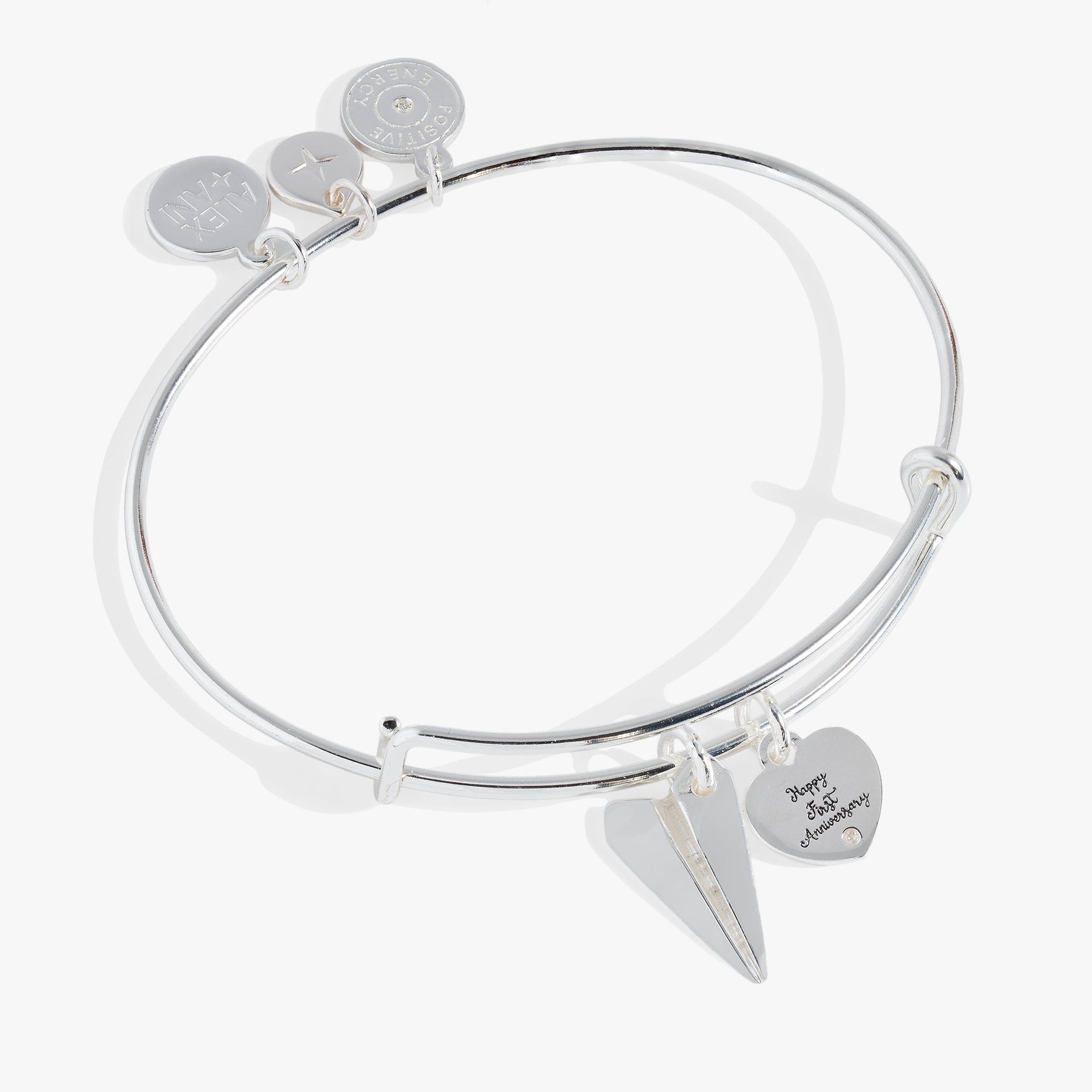 First anniversary bangle featuring a paper airplane charm and a crystal-adorned Happy First Anniversary tag