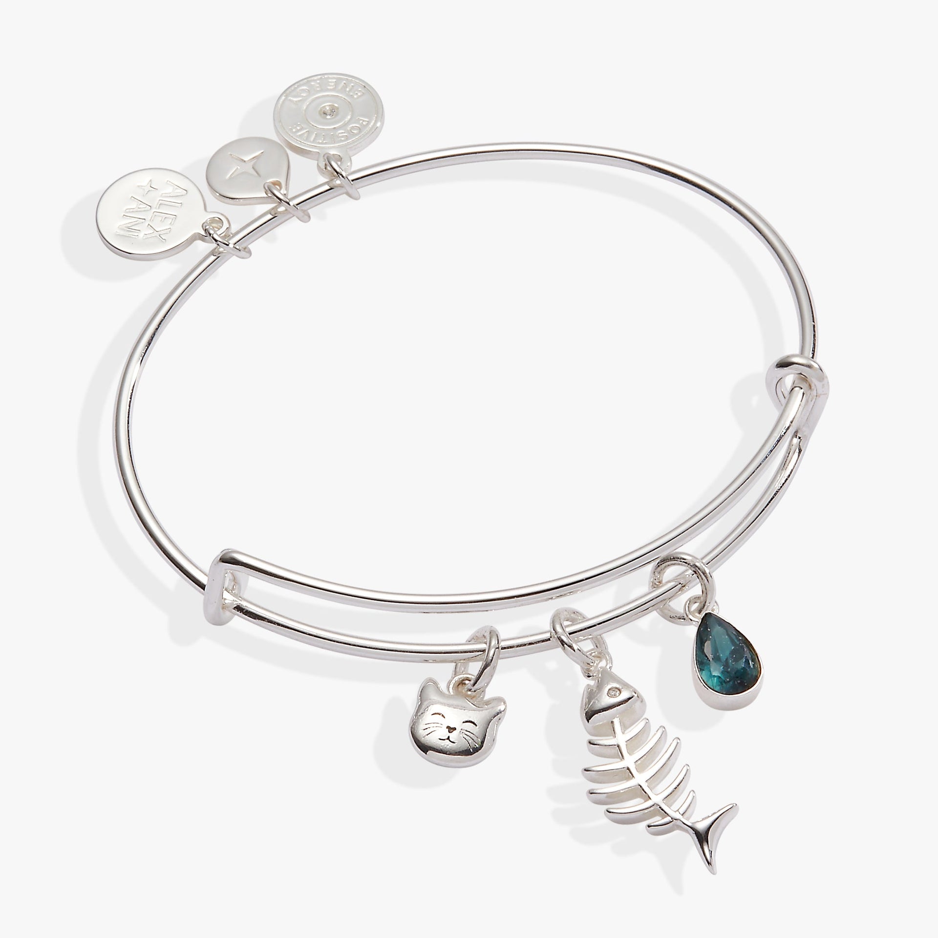 Expandable wire bangle with cat face, fish bone, and blue sapphire-colored crystal charms.