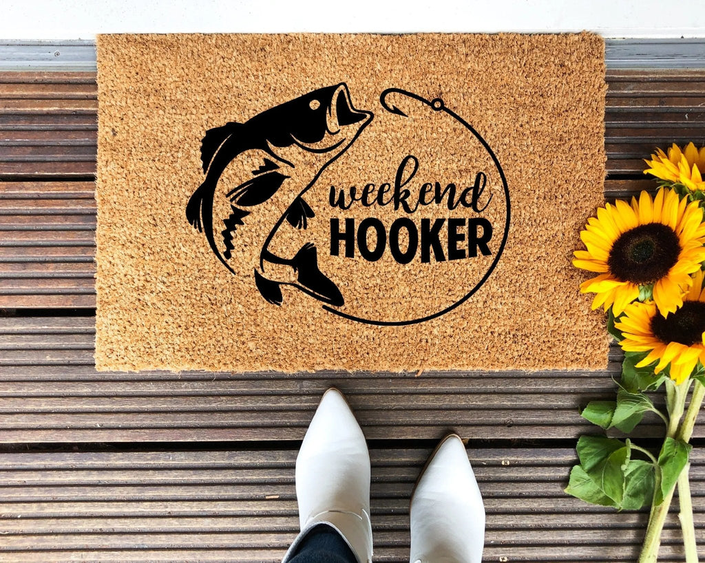 Fishing-themed welcome doormat in brown and black