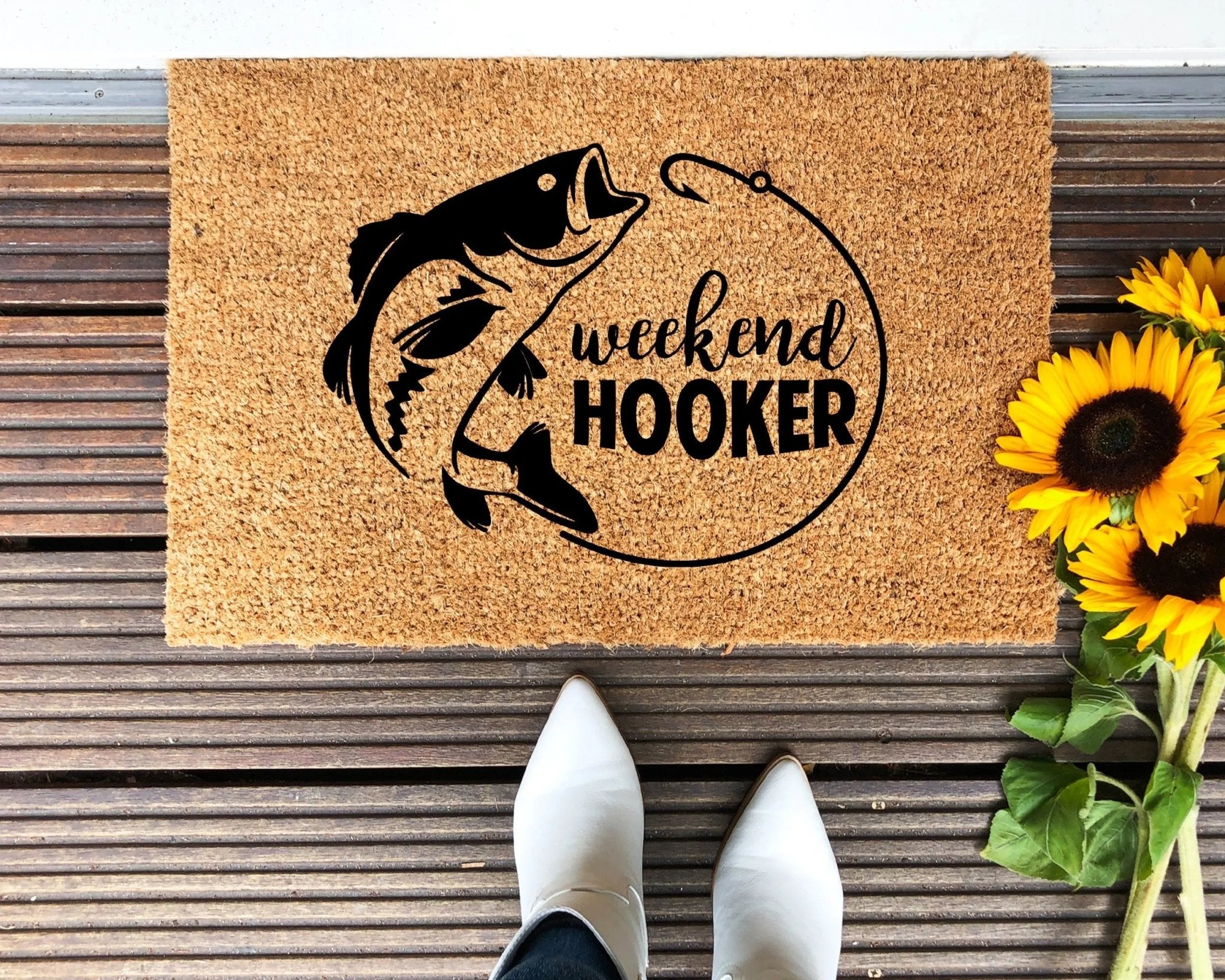 Fishing-themed welcome doormat in brown and black