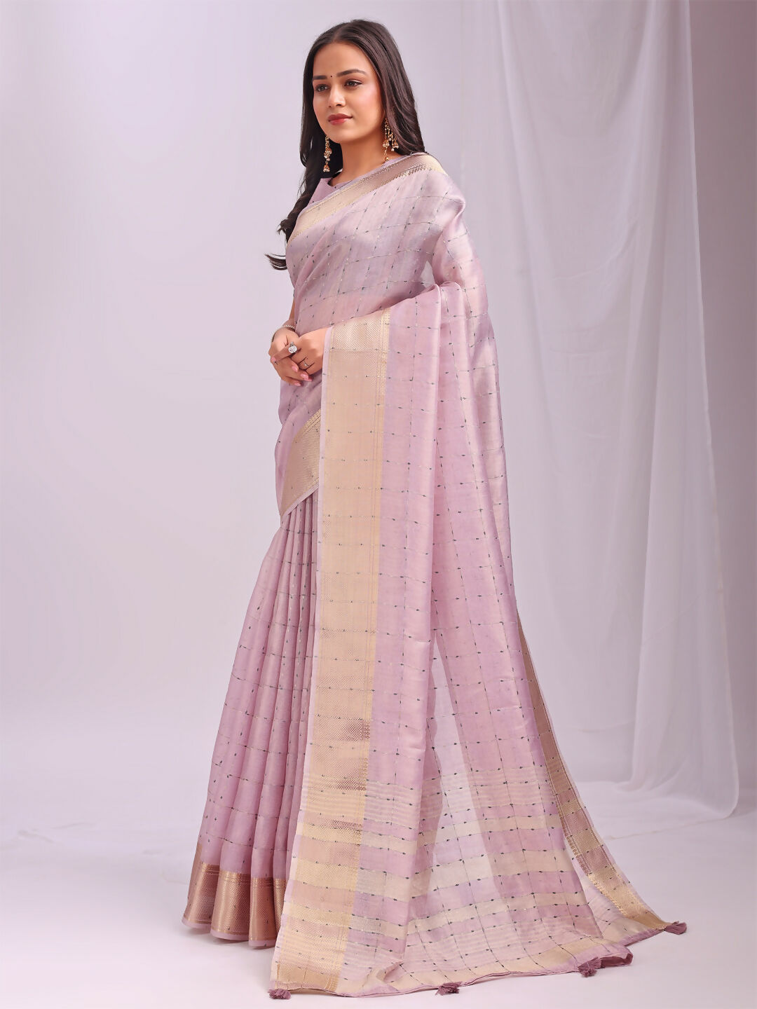 Beautiful Light Pink Organza Saree with matching blouse piece.