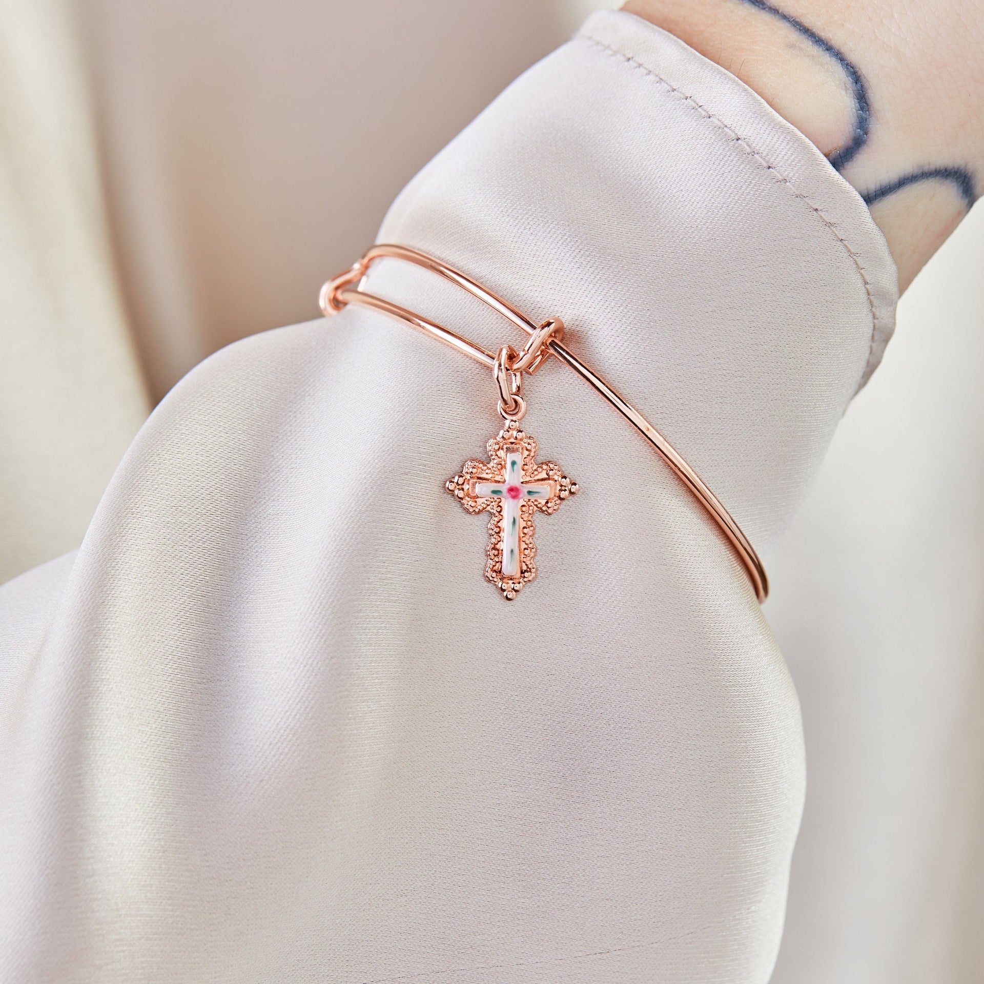 Floral Cross Charm Bangle Bracelet in Symbolic Design