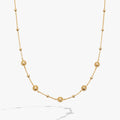 Gold-plated station chain necklace with textured floret charms