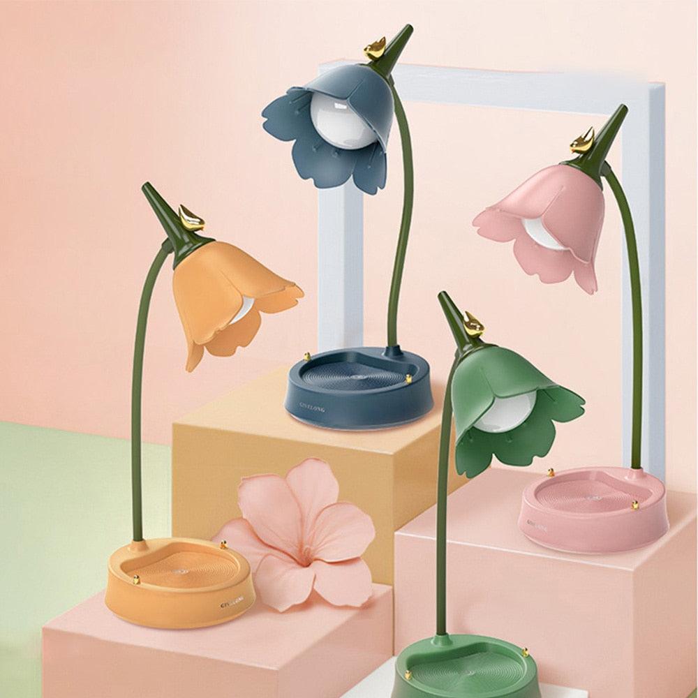 Cute flower-shaped LED table lamp with touch controls in various colors.