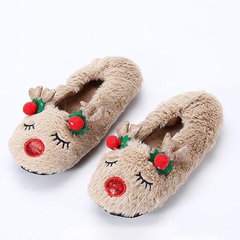 Women's cozy fuzzy Christmas slippers in beige with a horn button detail and plush fur lining.