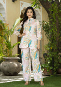 Woman wearing a stylish off-white muslin co-ord set in a bohemian resort-wear style