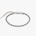 Silver stainless steel French rope chain bracelet with adjustable sliding clasp.