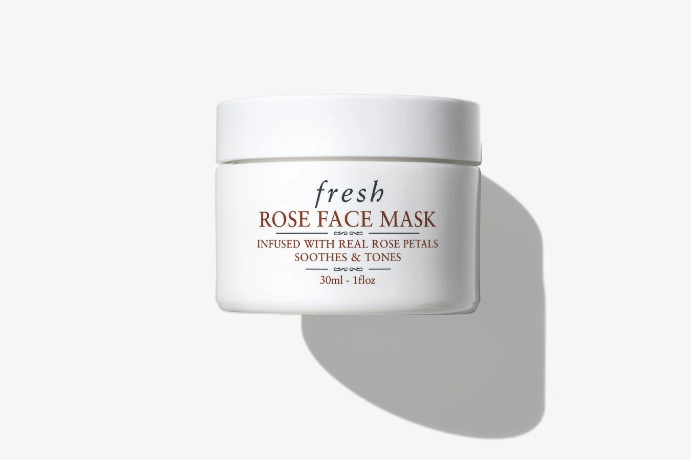 Jar of Fresh Rose Face Mask with visible real rose petals in a clear gel formula