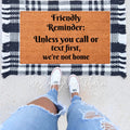 Natural coir farmhouse doormat with black text reading Unless You Call or Text First, placed on a porch.