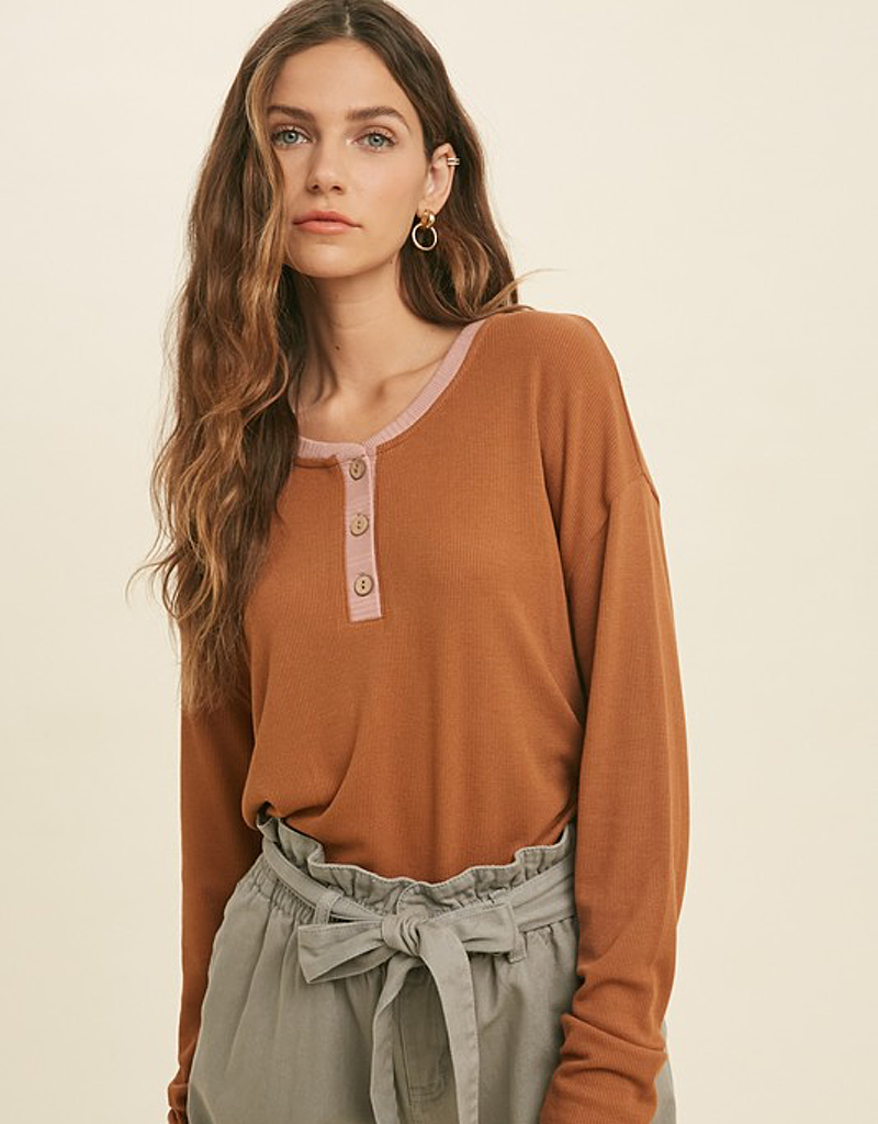 Close-up view of the Contrast Button-Up Knit Top featuring button detail and texture.